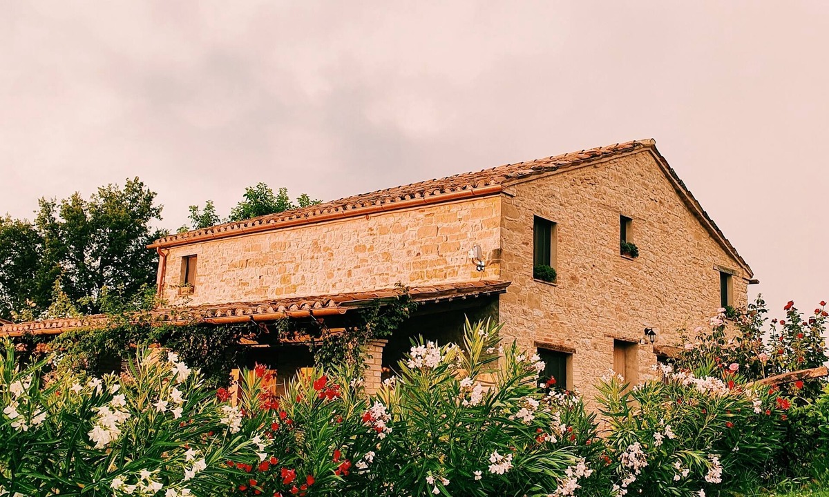 Penna San Giovanni House | A meticulously restored, historic Italian farmhouse with an incredible pool.