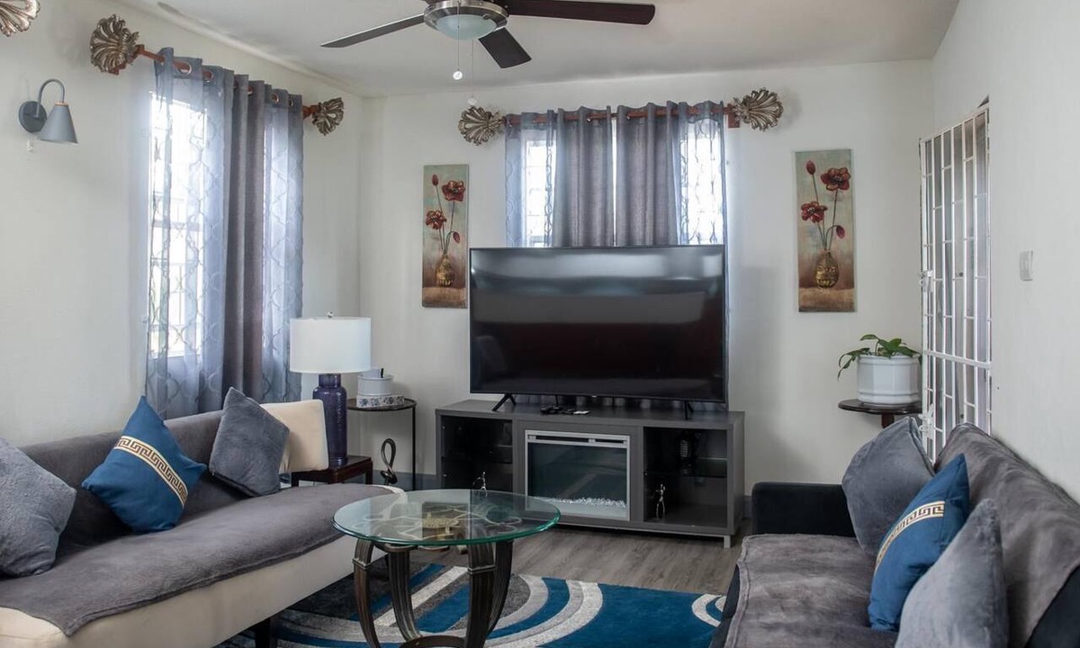 Harrismith House | Relaxing 3-bedroom home with flex-space AC and charming roof deck ocean view