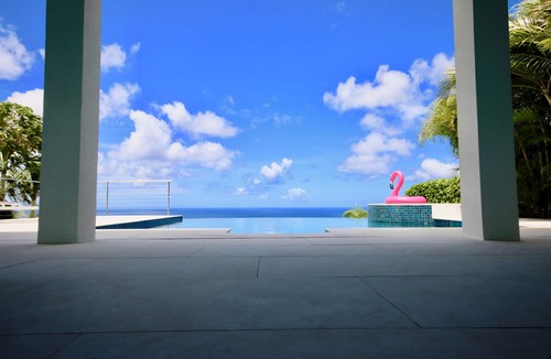 Deanes Villa | Caribbean Dream wows with ocean views from the sunny poolside deck.