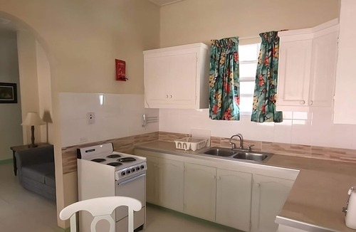 Rendezvous House | Explore Scenic Worthing Beach! Room w/Private Balcony & Kitchenette!