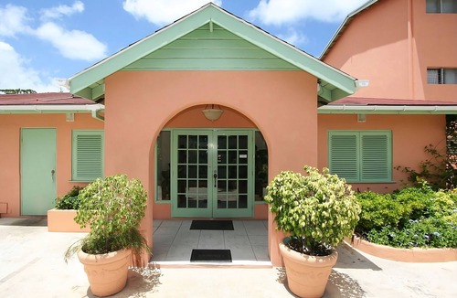 Rendezvous House | Explore Scenic Worthing Beach! Room w/Private Balcony & Kitchenette!