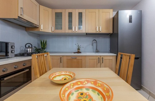 Comacchio Apartment | GuestHost - A comfortable and welcoming 75 square meters apartment with a large courtyard and private entrance, perfect for six people, located on the ground floor of a renovated historic building facing the canal (NOT accessible by car).The property enj