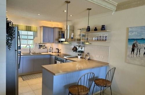St. Lawrence Gap Condo | REDUCED SUMMER RATES TO A SANDY BEACH AND SWAYING PALMS!