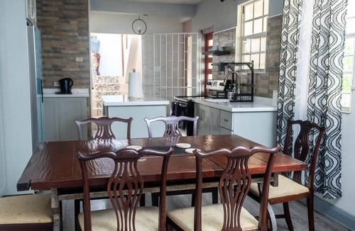 Harrismith House | Relaxing 3-bedroom home with flex-space AC and charming roof deck ocean view