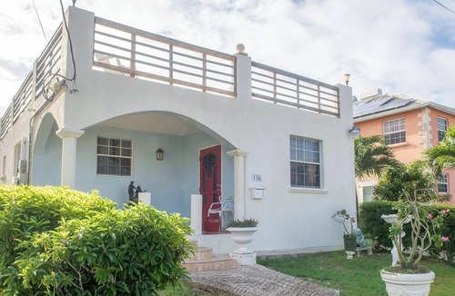 Harrismith House | Relaxing 3-bedroom home with flex-space AC and charming roof deck ocean view