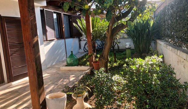 Cute little Villa with private garden just few steps away by the sea.