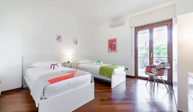 GuestHost - Roomy and tastefully furnished apartment, ideal for families as it accommodates up to 6 people having 2 bedrooms, 2 bathrooms, a balcony and an equipped terrace. The flat is located in a residential context with concierge and internal garden,