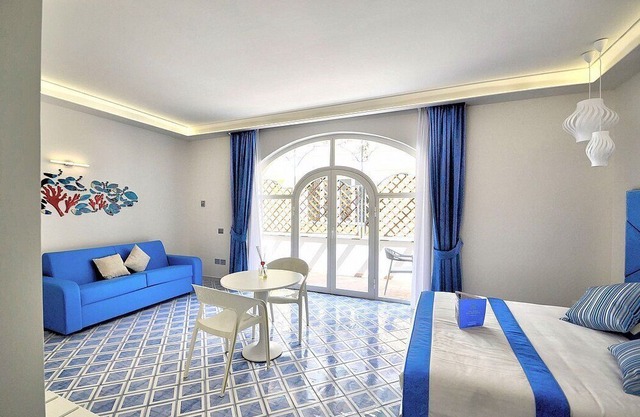 Villa Clarice D, fully refundable with voucher*: An elegant and modern studio apartment in a quiet position, located on a hillside above the sea, with Free WI-FI. in Amalfi